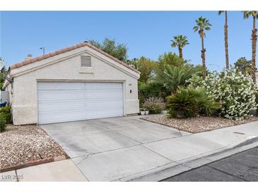 Single-Gathering home with a two-car garage, low-maintenance landscaping, and a traditional-style roofline at 2837 Du Barry Manor Ln, Las Vegas, NV 89108