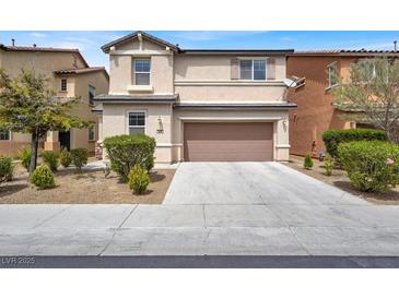 Inviting two-story home with a well-maintained front yard and attached two-car garage at 3638 Via Messina, Henderson, NV 89052