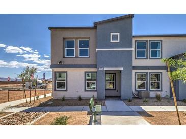 Modern two-story home featuring neutral tones and contemporary architectural details on a sunny day at 5004 Fern Mesa Ave # Lot 137, Las Vegas, NV 89139
