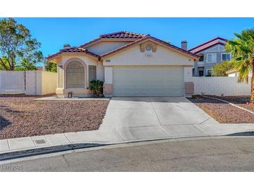 Charming single-story home with a two-car garage and low-maintenance desert landscaping at 9398 Sailing Water Ave, Las Vegas, NV 89147