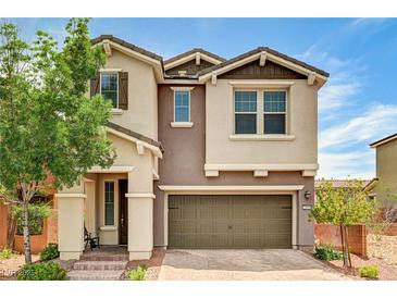 Inviting two-story home with a two-car garage and a charming front porch at 2159 Morro Vista Dr, Las Vegas, NV 89135