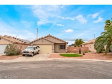 Charming single-story home with desert landscaping and a two car garage at 2319 Little Italy Ave, North Las Vegas, NV 89031