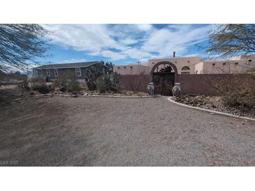 Charming desert home featuring a gated entrance, and a second home on the property at 5450 Humbolt Pl, Pahrump, NV 89060