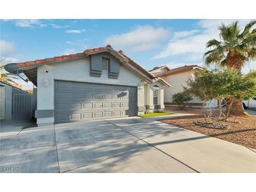 Charming single-story home with a two-car garage and well-maintained landscaping at 5553 Super Bowl Dr, Las Vegas, NV 89110