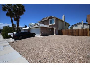 Charming two-story home featuring a spacious driveway, desert landscaping, and a well-maintained exterior at 6812 Sheffield Dr, Las Vegas, NV 89108
