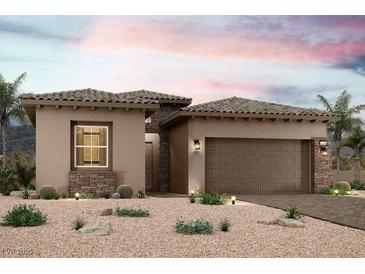 Inviting single-story home featuring desert landscaping, stone accents, and a charming tile roof at 75 Ibiza Lake Dr, Henderson, NV 89011