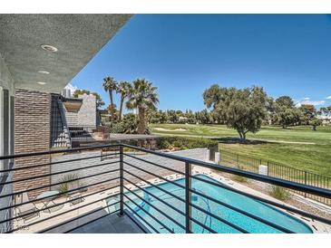 Balcony view of a sparkling pool and lush green golf course, offering a luxurious outdoor living experience at 778 Vegas Valley Dr, Las Vegas, NV 89109