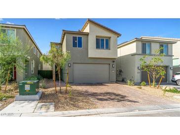 Charming two-story home featuring a two-car garage and a stylish brick driveway at 8021 Adelaide Hills St, Las Vegas, NV 89113