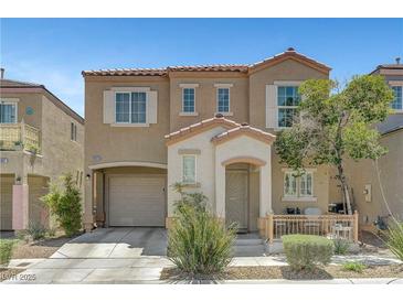 Charming two-story home featuring desert landscaping, a private entry porch, and an attached one car garage at 9065 Adorable Ave, Las Vegas, NV 89149