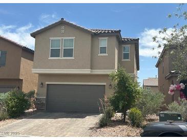 Two-story home featuring desert landscaping and a two-car garage at , Las Vegas, NV 89148