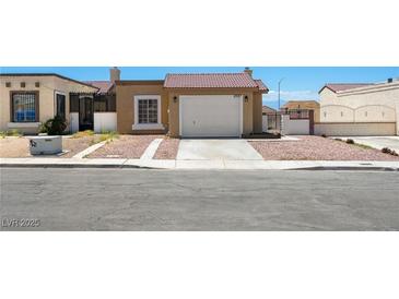 Charming single-story home featuring a well-maintained front yard, and a two car garage at 2337 Sierra Sunrise St, Las Vegas, NV 89156