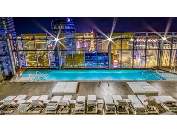 Stunning rooftop pool with city views and lounge chairs for ultimate relaxation at 3722 Las Vegas Blvd # 809, Las Vegas, NV 89158