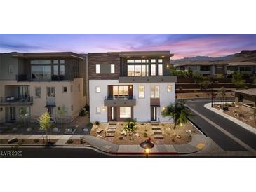 Beautiful two-story home featuring modern architectural elements and desert landscaping at 4153 Solace St, Las Vegas, NV 89135