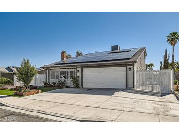 Charming single-story home with a well-maintained yard, solar panels, and a two-car garage at 4302 Newhaven Dr, Las Vegas, NV 89147