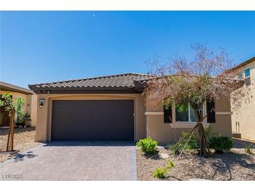 Charming single-story home with a desert-landscaped yard and a two-car garage at 6829 Painted Morning Ave, Las Vegas, NV 89142