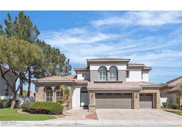 Charming two-story home with a three-car garage and well-maintained landscaping, perfect for Gathering living at 2826 Barrow Downs St, Las Vegas, NV 89135