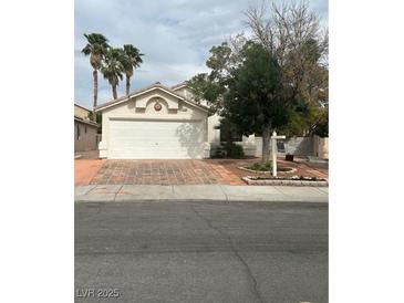 Charming single-story home with a two-car garage and tile driveway at 3729 Bronco Billy Ct, Las Vegas, NV 89129