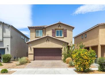 Charming two-story home with well-maintained landscaping and a paved driveway at 7819 Rachelis St, North Las Vegas, NV 89084