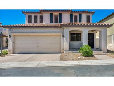Charming two-story home with a two-car garage and landscaped front yard at 9165 Starling Wing Pl, Las Vegas, NV 89143