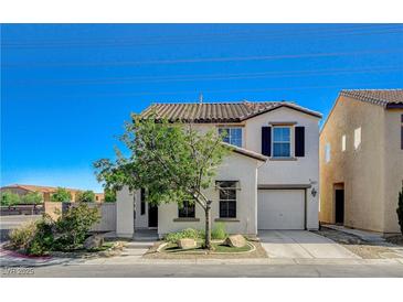 Charming two-story home with a stucco exterior, tile roof, and well-maintained front yard at 9931 Cherry Melee Ave, Las Vegas, NV 89148