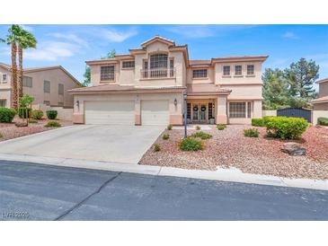 Stunning two-story home featuring a tile roof, balcony, and a two-car garage at 7310 Heggie Ave, Las Vegas, NV 89131