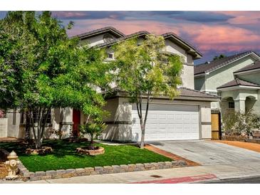 Charming two-story home with a well-maintained front yard, mature trees, and a two-car garage at 7429 Fencerow St, Las Vegas, NV 89131