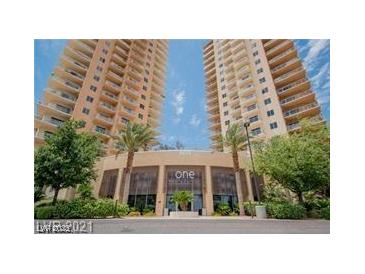 Luxury high-rise building featuring modern architecture, lush landscaping, and a grand entrance at 8255 Las Vegas Blvd # 611, Las Vegas, NV 89123