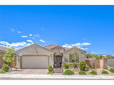 Charming single-story home featuring a well-maintained front yard, desert landscaping, and an attached two-car garage at 8269 Skye Peak St, Las Vegas, NV 89166