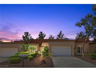Charming single story home with desert landscaping, two-car garage, and a red tile roof, perfect for relaxed living at 8629 Prairie Hill Dr, Las Vegas, NV 89134