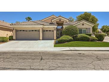 Charming single-story home featuring a well-manicured lawn and a spacious three-car garage at 1314 Rossini St, Henderson, NV 89052