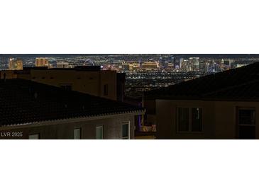 Striking Las Vegas skyline view from a rooftop in a residential neighborhood at night at 2246 Bird Of Prey St, Las Vegas, NV 89138