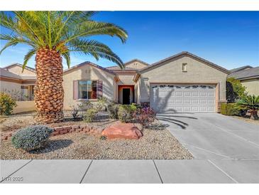 Charming single-story home featuring a two-car garage, desert landscaping, and a well-maintained front yard at 2520 Eclipsing Stars Dr, Henderson, NV 89044