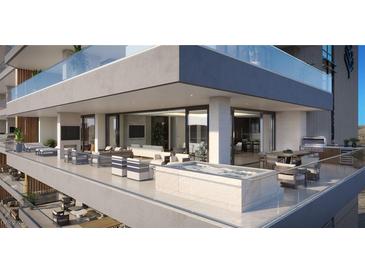 Luxury condo balcony featuring a private jacuzzi and outdoor seating with city views at 400 Rock Peak Dr # 2301, Henderson, NV 89012
