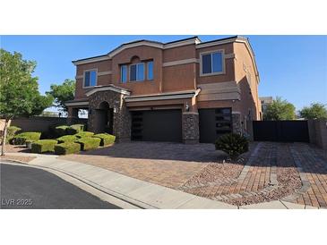 Attractive two-story home featuring a three-car garage and well-manicured landscaping at 7380 Abundant Harvest Ave, Las Vegas, NV 89131