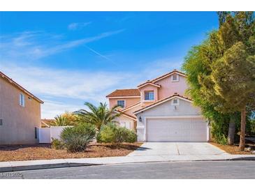 Charming two-story home with a tile roof, desert landscaping, and a two car garage at 1011 Pearl Marble Ave, North Las Vegas, NV 89081
