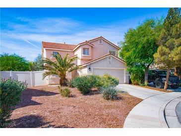 Charming two-story home featuring a well-maintained front yard and a two-car garage at 1011 Pearl Marble Ave, North Las Vegas, NV 89081