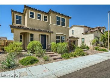 Charming two-story home with a well-manicured front yard at 10271 Bark Pine Ct, Las Vegas, NV 89166