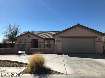 Charming single-story home with a well-maintained front yard and a two-car garage at 1083 Sterling Peak St, Las Vegas, NV 89110