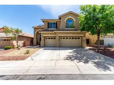 Charming two-story home with a three car garage and low maintenance desert landscaping at 432 Emerald Heights St, Las Vegas, NV 89144