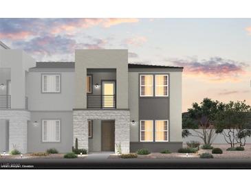 Modern home features a stylish stone facade, balcony, neutral color palette, and well-maintained landscaping at 5761 Crenellated St # Lot 60, Las Vegas, NV 89148