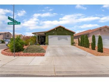 Charming single-story home with a well-manicured front yard and a two-car garage at 3617 Walnut Wood St, Las Vegas, NV 89129