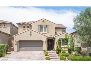 Charming two-story home features desert landscaping and a tiled roof at 3698 Regatta Landing Dr, Las Vegas, NV 89141