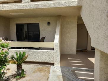 Inviting condo front entry with a small patio and desert landscaping at 3771 Desert Marina Dr # 95, Laughlin, NV 89029