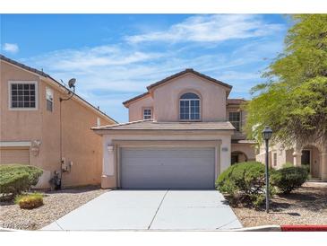 Charming two-story home featuring a two-car garage and well-maintained landscaping at 4149 Dignified Ct, North Las Vegas, NV 89032