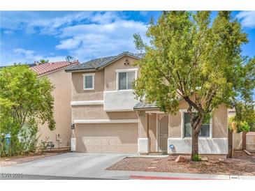 Charming two-story home featuring desert landscaping, neutral stucco, and a two-car garage at 5024 Granite Creek Ct, Las Vegas, NV 89131
