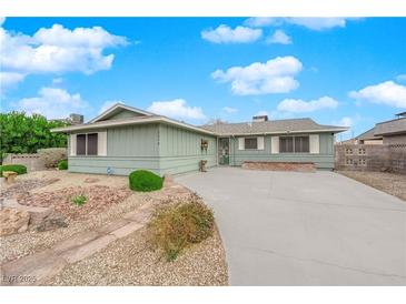 Charming single-story home featuring a well-maintained lawn and a welcoming entryway at 2058 Citroen St, Las Vegas, NV 89142