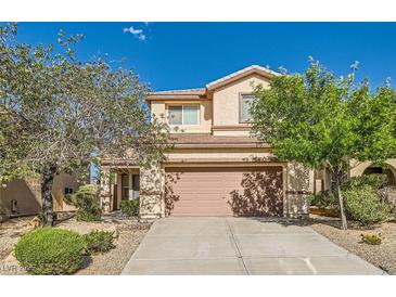 Charming two-story home with a well-manicured front yard and attached two-car garage at 2728 Holmfault St, Henderson, NV 89044