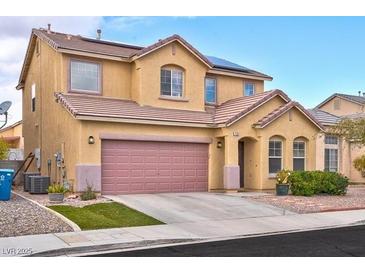 Charming two-story home with a spacious two-car garage, desert landscaping, and solar panels at 7129 Dillseed Dr, Las Vegas, NV 89131