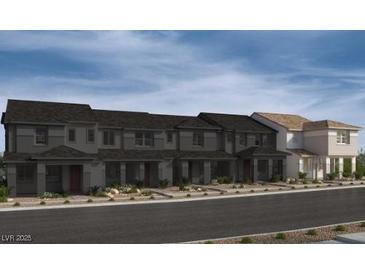 Beautiful townhome exterior showcasing modern architecture, landscaping, and inviting curb appeal at 124 Silver Run Ln, Las Vegas, NV 89138