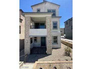 Charming two-story home with stone accents and a well-maintained, low-maintenance gravel front yard at 1533 Bat Hawk St, Las Vegas, NV 89144